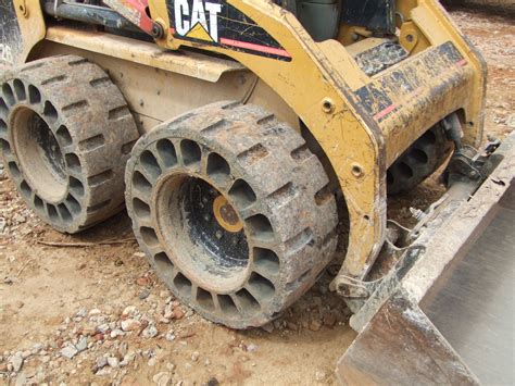 airless tires skid steer|no flat skid loader tires.